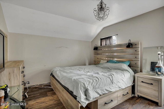 bedroom with vaulted ceiling and dark hardwood / wood-style floors