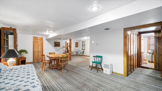 interior space featuring carpet, connected bathroom, and a closet