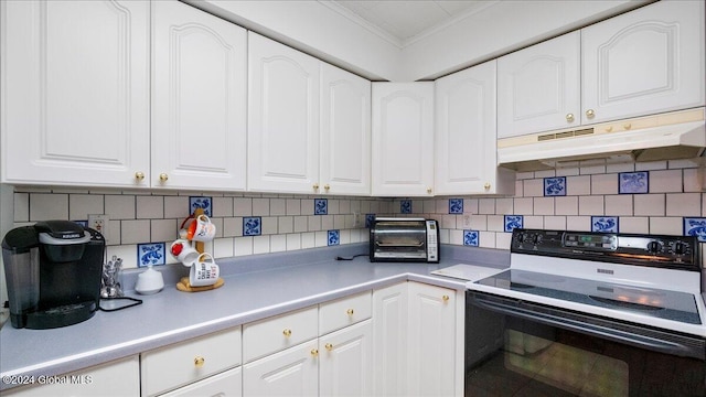 kitchen with range with electric stovetop, white cabinetry, and ornamental molding