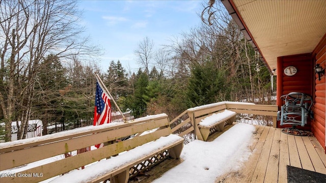 view of snow covered deck