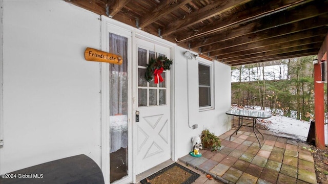 view of snow covered property entrance