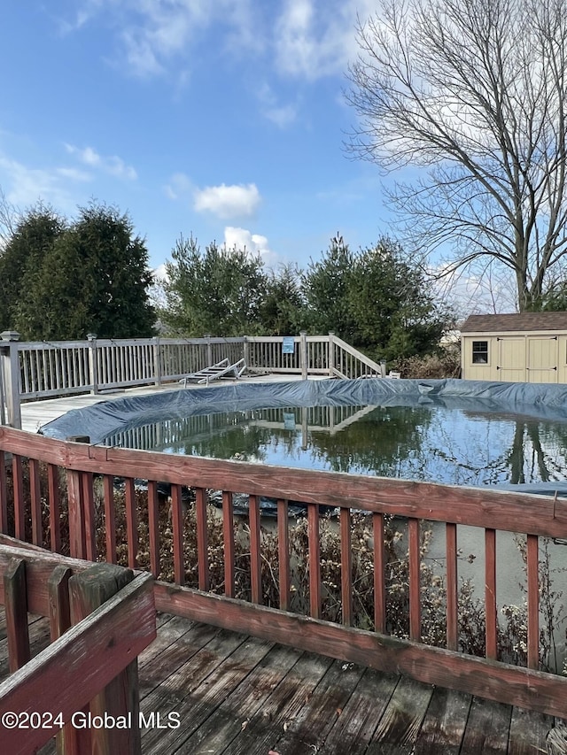 wooden deck with a covered pool