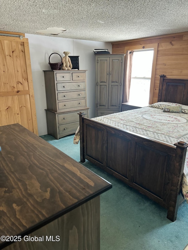 unfurnished bedroom with carpet flooring and a textured ceiling