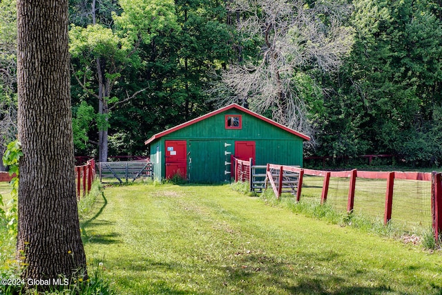 view of outdoor structure with a lawn