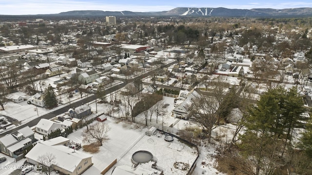 snowy aerial view featuring a mountain view