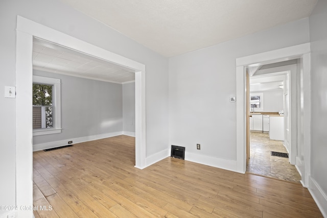 unfurnished room featuring light wood-type flooring