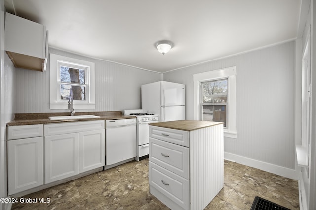 kitchen featuring wood counters, white appliances, white cabinetry, and sink