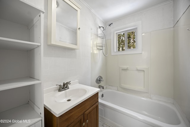 bathroom with vanity, shower / bath combination, ornamental molding, and tile walls