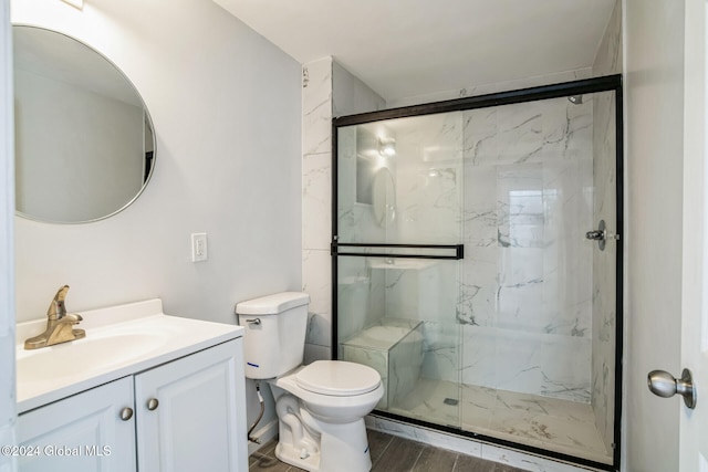 bathroom featuring toilet, vanity, wood-type flooring, and walk in shower