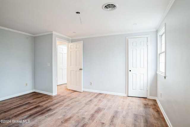 unfurnished bedroom featuring light hardwood / wood-style floors and ornamental molding