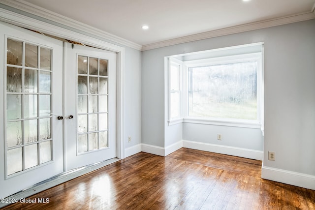 doorway with wood-type flooring and ornamental molding