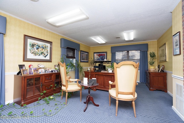 office space featuring carpet floors, a textured ceiling, and ornamental molding