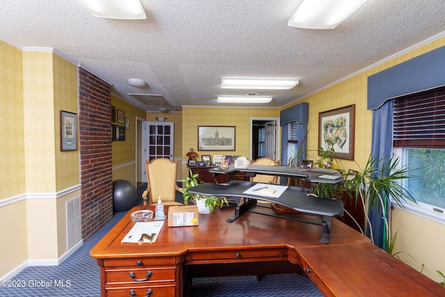 carpeted office with a textured ceiling and ornamental molding