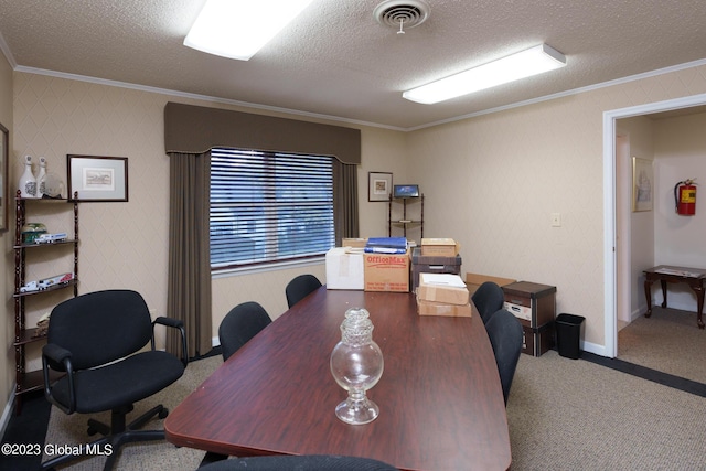 carpeted office featuring ornamental molding and a textured ceiling