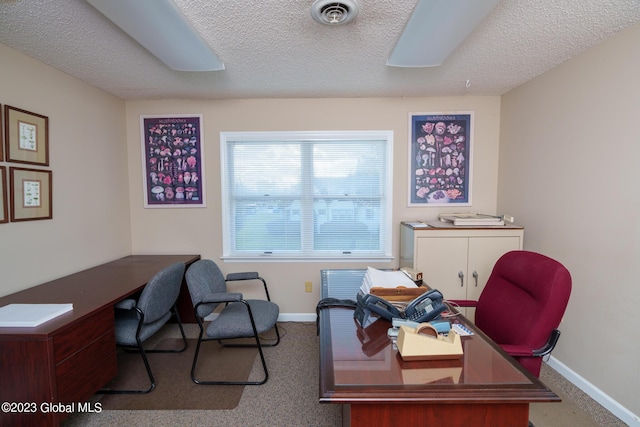 office area with a textured ceiling