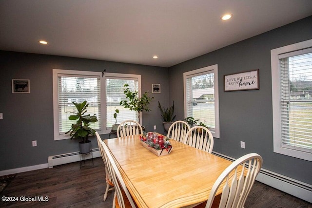 dining area with plenty of natural light, dark hardwood / wood-style flooring, and a baseboard radiator