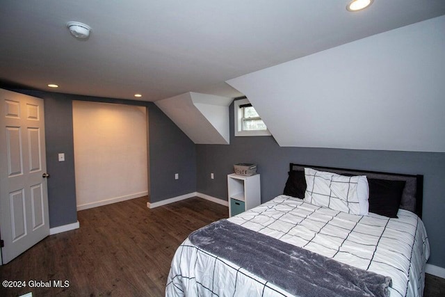 bedroom featuring dark hardwood / wood-style flooring and vaulted ceiling