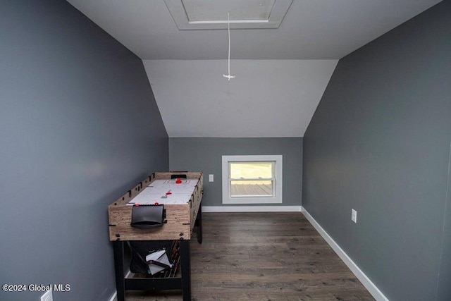 rec room featuring dark wood-type flooring and lofted ceiling