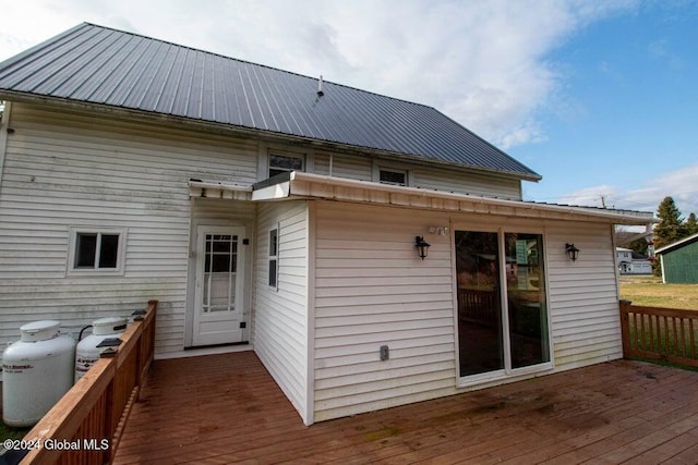 rear view of property with a wooden deck