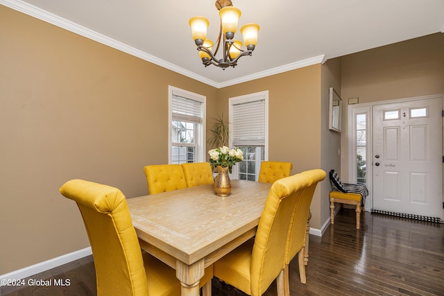 dining room featuring a notable chandelier, dark hardwood / wood-style floors, and ornamental molding