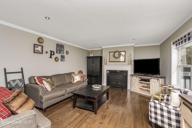 living room featuring dark hardwood / wood-style flooring and ornamental molding