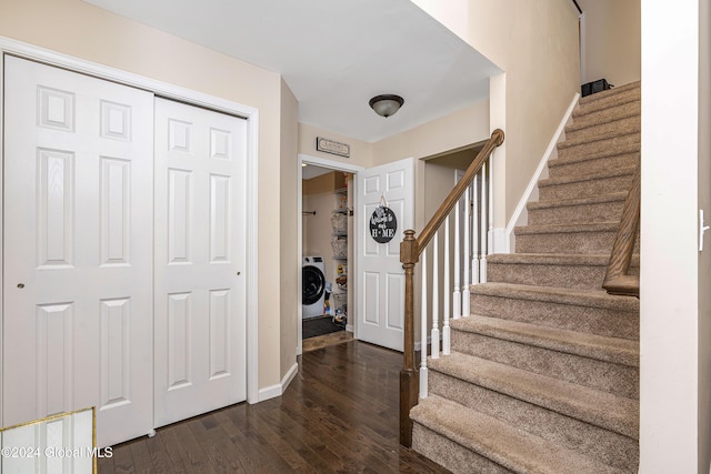 entryway featuring dark hardwood / wood-style floors and washer / clothes dryer