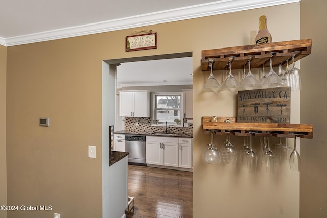 bar with white cabinetry, dishwasher, dark hardwood / wood-style floors, and sink