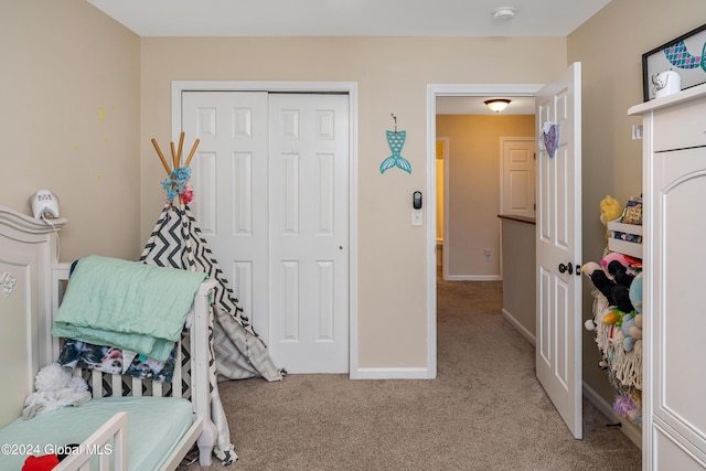 carpeted bedroom with a closet