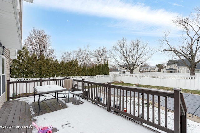 view of snow covered deck