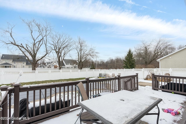 view of snow covered deck