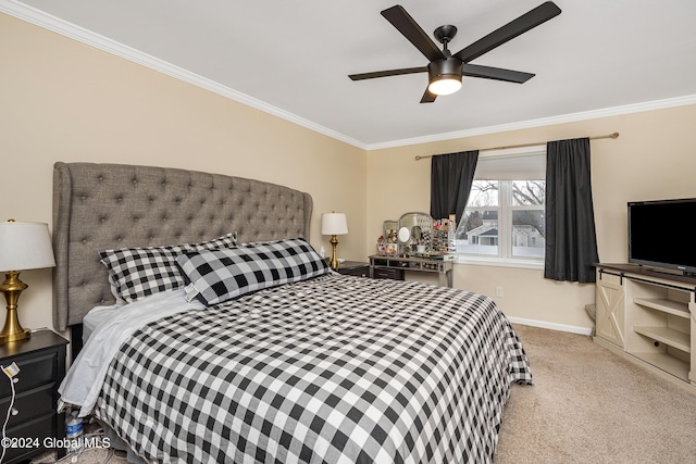 carpeted bedroom featuring ceiling fan and crown molding