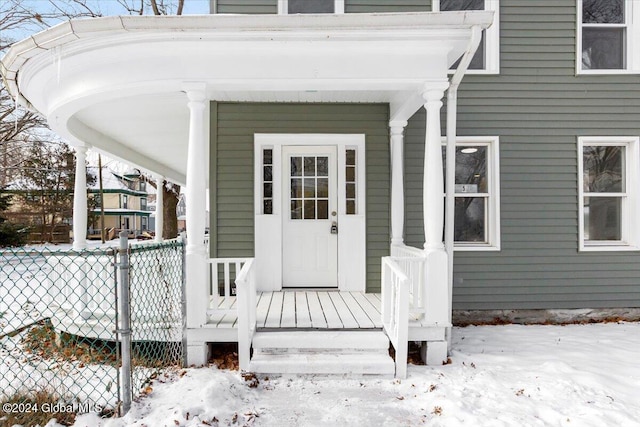 view of snow covered property entrance