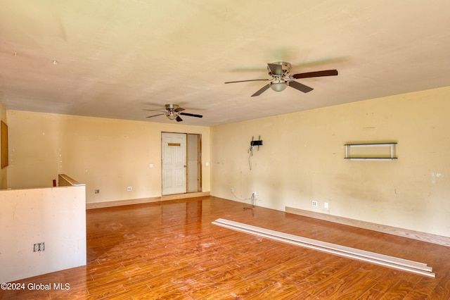 spare room with wood-type flooring and ceiling fan