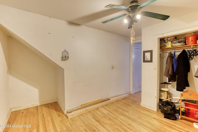 interior space with ceiling fan, a closet, and light wood-type flooring