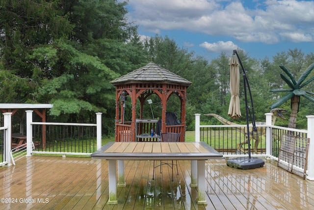 wooden terrace with a gazebo