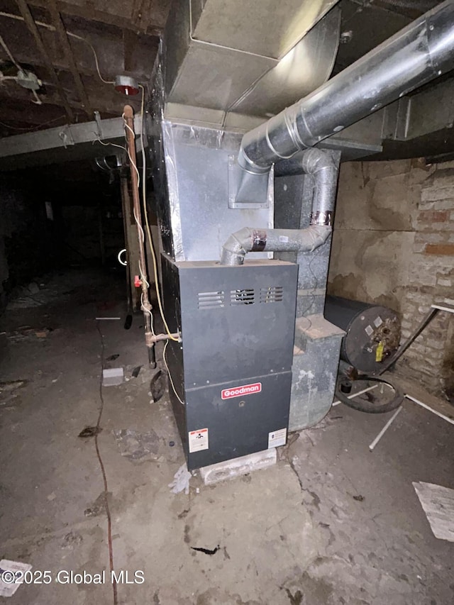 utility room with heating unit