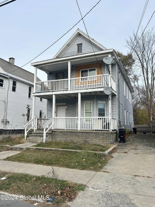 view of front of property with a balcony