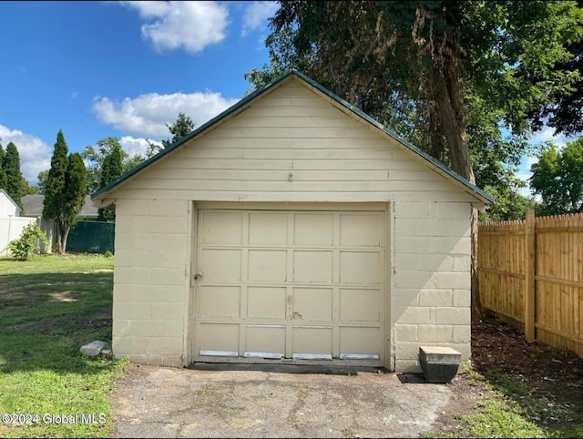 garage with a lawn