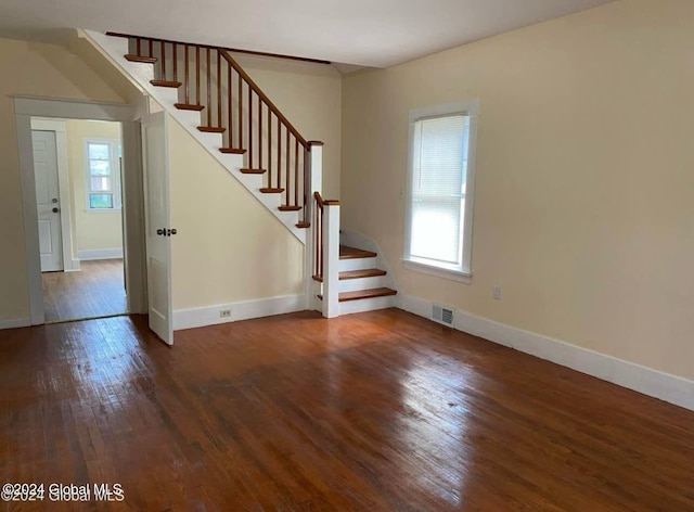 interior space featuring dark hardwood / wood-style floors and a healthy amount of sunlight