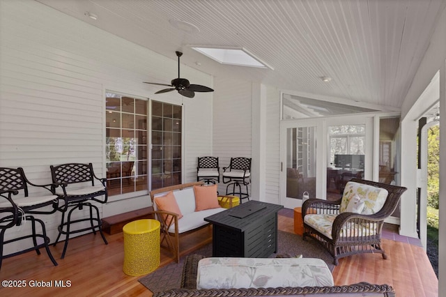 interior space featuring an outdoor living space and ceiling fan