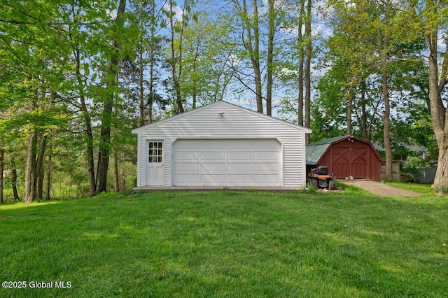 garage with a lawn