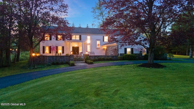 view of front of property with a lawn