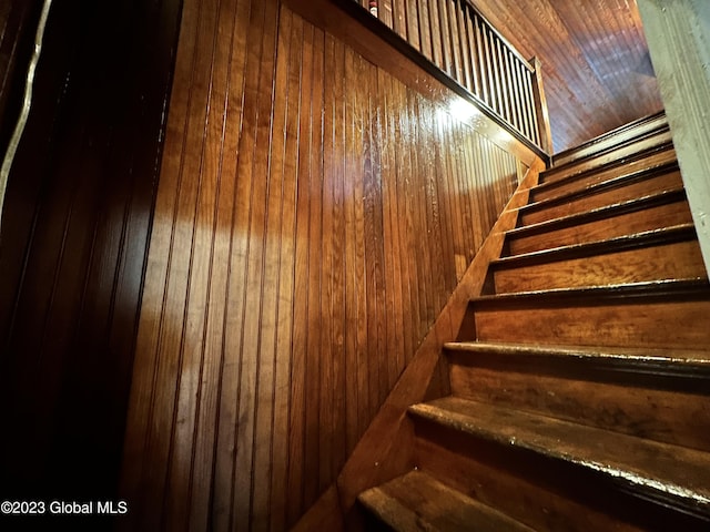 staircase with wooden walls