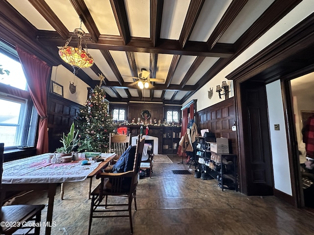 dining room featuring ceiling fan, beam ceiling, crown molding, and coffered ceiling