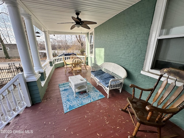 deck featuring a porch and ceiling fan