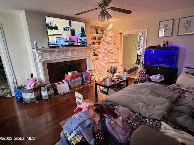 living room with hardwood / wood-style floors and ceiling fan