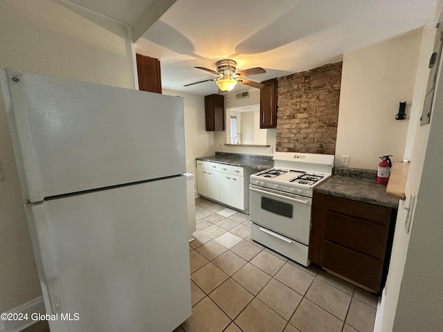 kitchen with ceiling fan, dark brown cabinets, white appliances, and light tile patterned floors