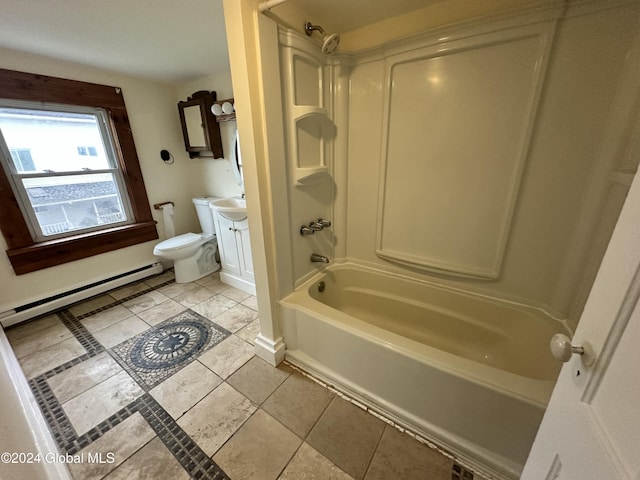 full bathroom with washtub / shower combination, baseboard heating, tile patterned floors, toilet, and vanity