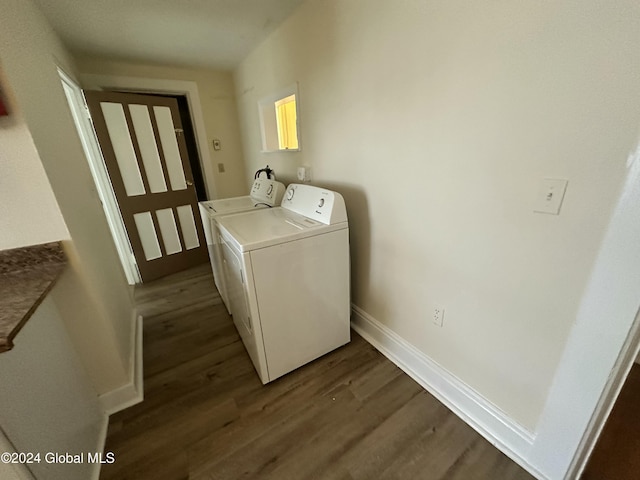 laundry room featuring independent washer and dryer and dark hardwood / wood-style floors