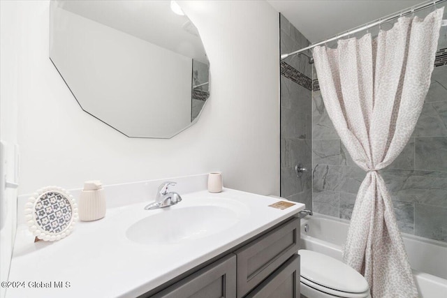 bathroom with vanity, toilet, and shower / bath combo